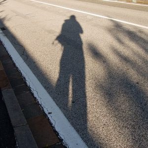 shadow from katarzynas body on concret street